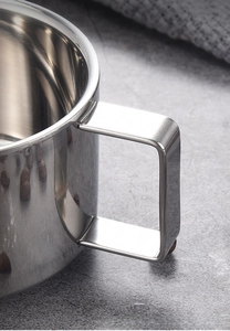 Macro shot of 304 stainless steel coffee mug showing sturdy handle welding detail