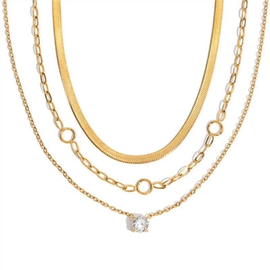 Three-layer stainless steel necklace set with snake chain and zircon pendant on white background
