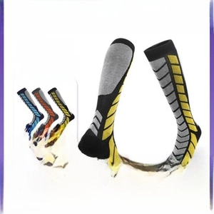 Detailed texture of thick merino wool ski socks with anti-slip geometric patterns