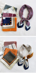 Various silk square scarves with geometric patterns and retro prints displayed on white fabric