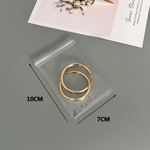 Pair of gold hoop earrings in a 10x7cm transparent PVC self-sealing storage bag