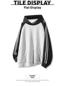 Detail view of heather grey and black raglan hoodie with classic white sleeve stripes