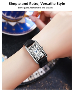 Close-up of vintage square quartz watch with black leather strap on female wrist