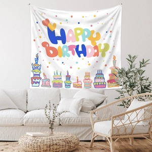 Bohemian happy birthday tapestry hanging over a sofa for festive room wall decoration