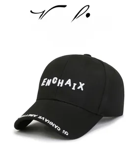 Detailed close-up of premium white 3D embroidery on a black cotton baseball cap