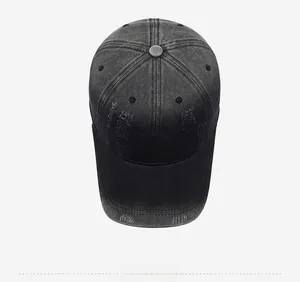 Top down view of distressed dark grey denim baseball cap with FBQE embroidery and torn details