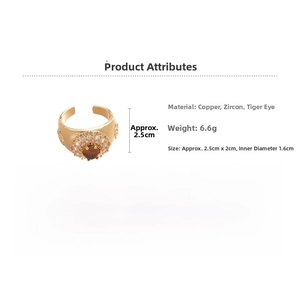 Detailed view of 18k gold plated tiger eye ring with cubic zirconia inlay and open band