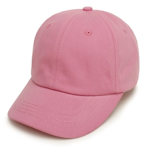 Detailed close-up of a pink solid color baseball cap with high quality stitching and fabric