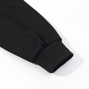 Close-up of black ribbed knit cuffs on a long-sleeve hoodie showing texture details