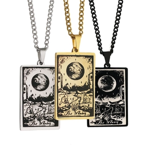 Detailed view of rectangular tarot necklaces in silver, gold, and black with The Moon motif