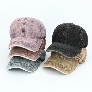 Flat lay of five vintage washed cotton baseball caps in multiple colors and textures