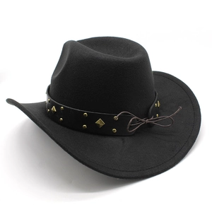 Detailed close-up of a black wool cowboy hat with gold studs and a brown rope detail