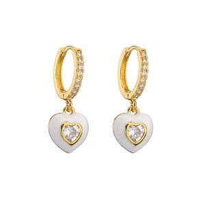 Macro detail of gold-plated heart earrings with white enamel and sparkling zircon stones