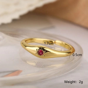 Macro shot of gold ring with red gemstone and technical size measurements 1.7cm
