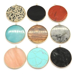 Selection of nine round natural stone pendants with elegant gold metal frames