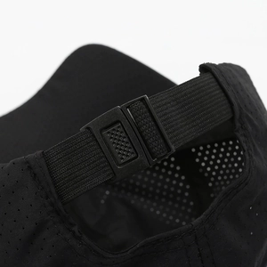 Rear view of black quick-dry baseball cap with adjustable plastic strap and breathable mesh