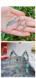 Détail de boucles d'oreilles pampilles en zircone colorée avec monture argentée