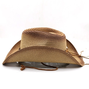 Detail of gradient brown straw cowboy hat showing weave texture and chin strap
