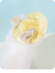 Detail of yellow tie-dye pet sun hat with ear holes for small dogs and cats