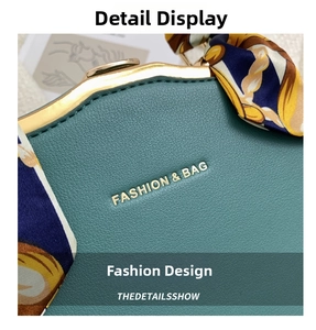 Detail of teal pebble leather bag with gold metal frame and silk scarf handle decoration