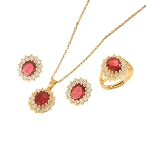 Elegant gold jewelry set with oval red stones and small white zircons for women