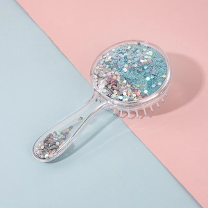 Sparkly paddle hair brush with blue liquid and sequins in a transparent round handle