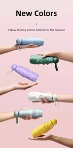 Mini five-fold pocket umbrellas in six pastel colors shown against a pink background