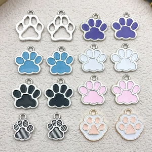 Macro view of assorted colorful DIY animal paw print alloy charms for keychains