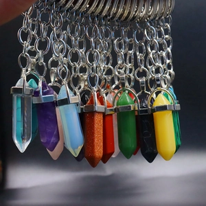 Detail showing various hexagonal crystal stone pendants with silver metal keychains