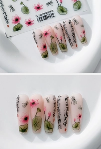 Macro detail of Chinese ink style lotus nail decals with matte finish art on long coffin nails