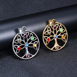 Detailed view of Tree of Life pendants in gold and silver with colorful gemstones