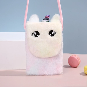 Detail of plush unicorn crossbody bag with rainbow horn and gradient white-pink texture