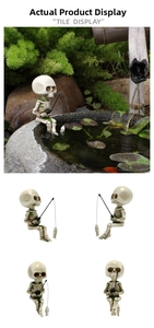 Detail of fishing skeleton figurine with moss finish and fish bone rod for garden decor