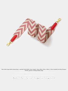 Close-up of red and white woven shoulder strap with leather ends and gold metal hooks