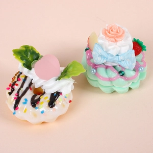 Artificial donut and cupcake keychain pendants with strawberry and cream decoration