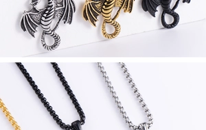 Close-up of a punk-style dragon pendant necklace in silver, gold, and black metal finishes