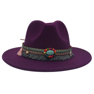 Detail of purple felt cowboy hat with ethnic braided band and turquoise stone accent