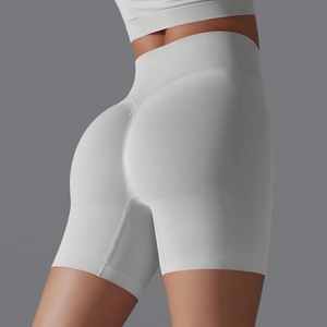 Close-up of light grey seamless yoga shorts featuring high waist and scrunch butt detail
