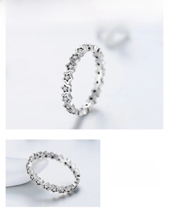 Close-up of S925 silver star ring with round white zircon stones in an eternity band