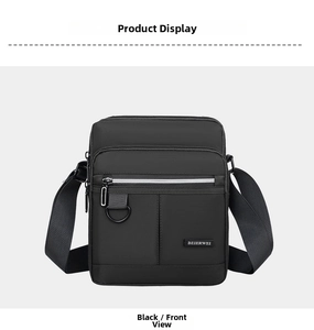 Front detail of black oxford cloth messenger bag with durable zippers and D-ring