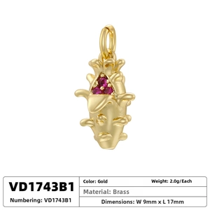 Macro shot of 9mm brass dragon fruit pendant with red crystal and gold plating