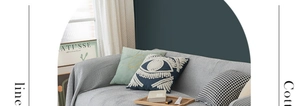 Detail of grey waffle weave sofa cover with decorative throw pillows in modern home setting