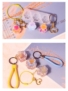 DIY cat paw silicone mold kit with finished resin keychains and colorful accessories