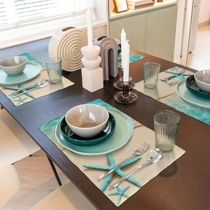 Mediterranean beach themed placemats with starfish patterns in a coastal dining set