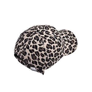 Detail of leopard print baseball cap featuring metal buckle and adjustable back strap