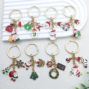 Set of 8 colorful Christmas keychains including Santa and reindeer on white background