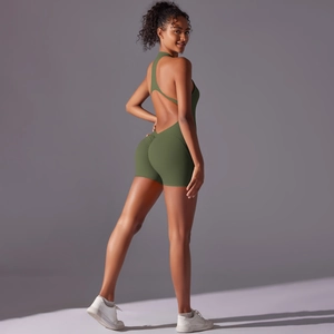 Detail of olive green athletic bodysuit with open back design and ruched butt lifting effect