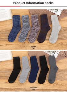 Flat lay of thick winter wool socks in varied colors on a cozy wooden background