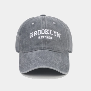 Front detail of gray washed cotton baseball cap featuring Brooklyn embroidery