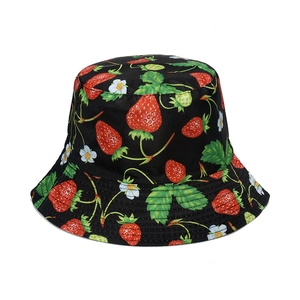 Detailed view of black cotton bucket hat with strawberry embroidery and reinforced stitching